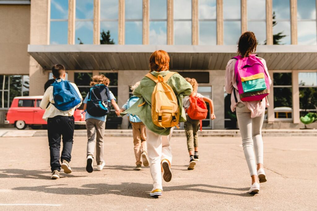 students running to school