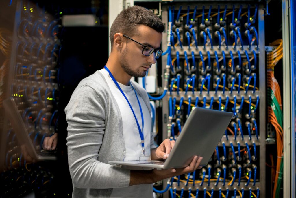 man managing supercomputer servers